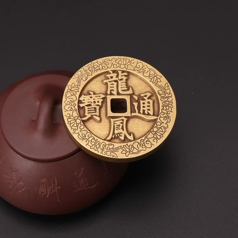 Large, thickened antique brass Feng Shui ornament featuring a dragon and phoenix, with characters "Tongbao" on the back, "Si
