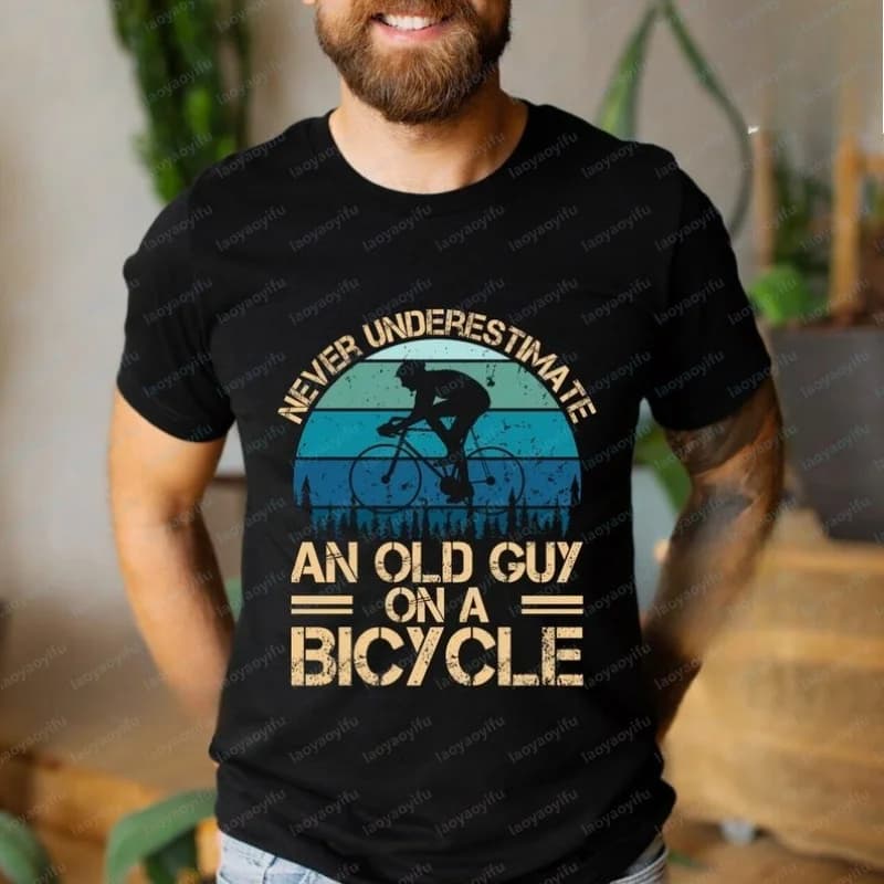 Funny Cyclist Cotton T-Shirt: Never Underestimate An Old Guy on A Bicycle Graphic T Shirts Harajuku Mens T Shirts Streetwear Top