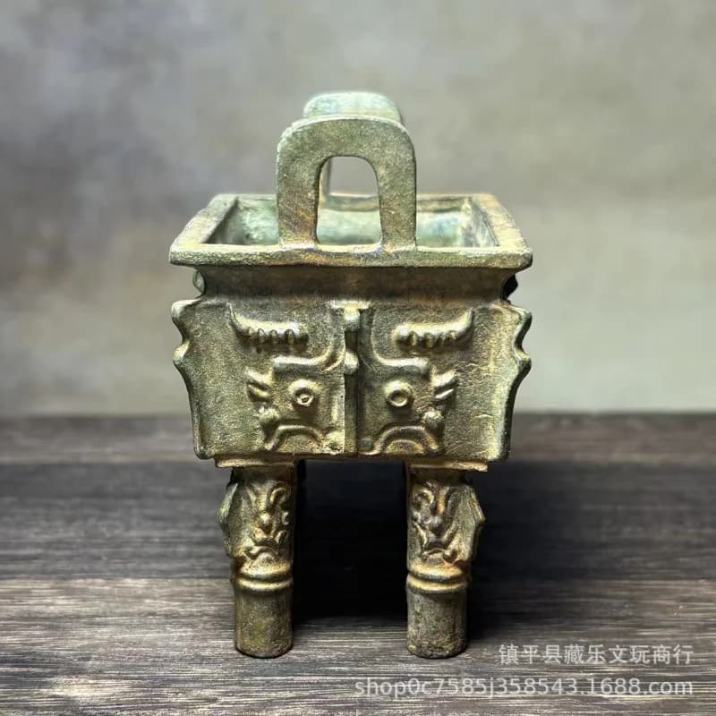 square with animal face pattern, aged bronze tripod ornament, vintage Shang and Zhou period decorative incense bur