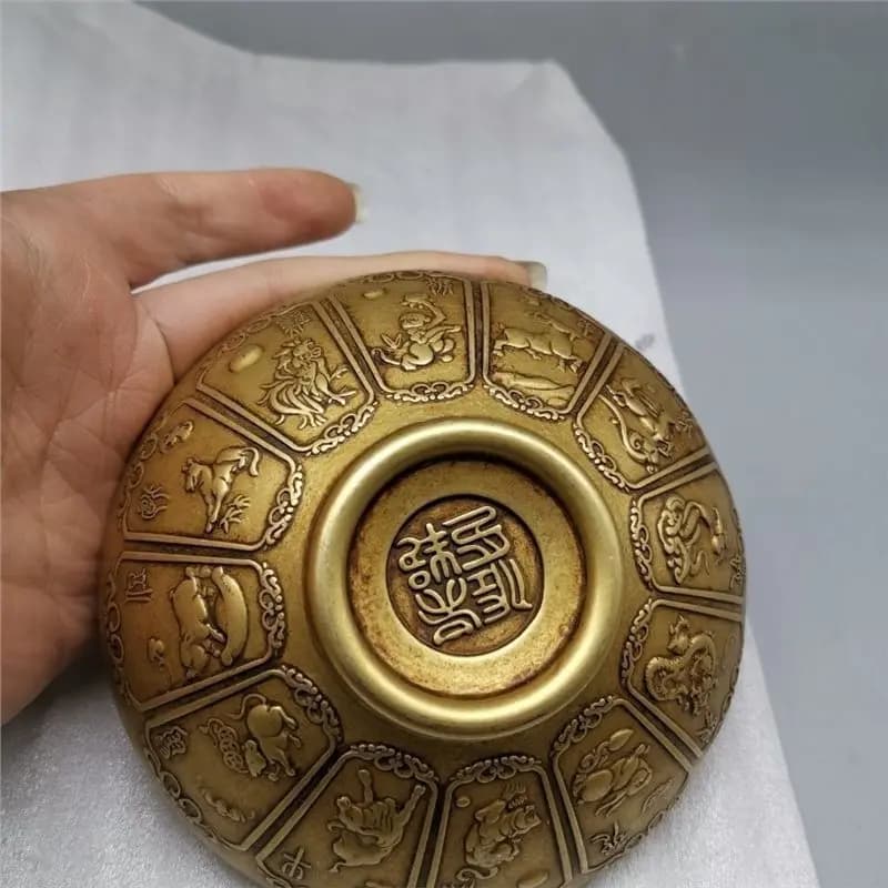 Antique copperware, small , design; finely crafted, brass bowl with zodiac animal motifs
