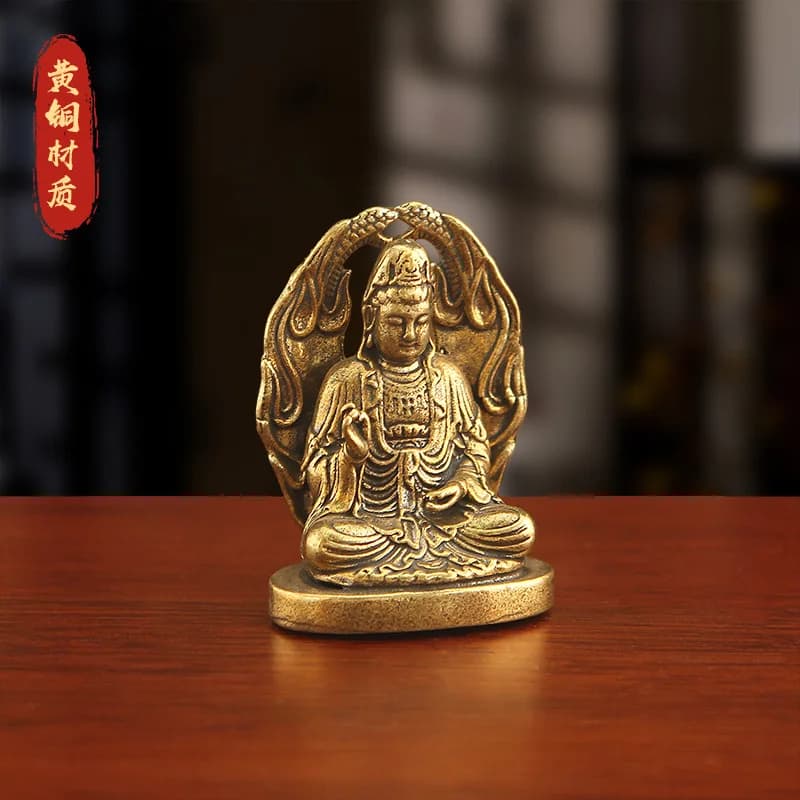 Brass Bodhisattva statue, depicting Guanyin in a meditative pose, with a snake-shaped pedestal and lotus flower ornament