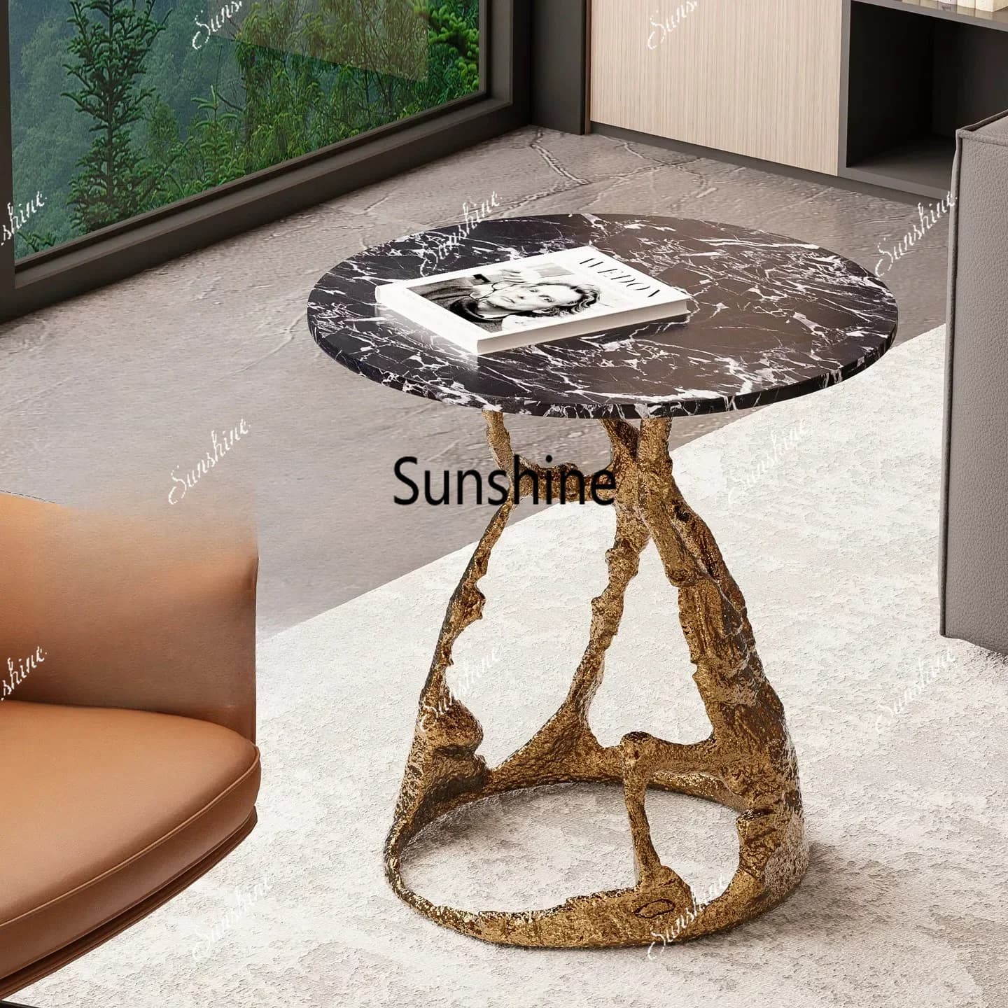 A few high-end round tables next to the light luxury imitation brass sofa, high-end artworksTJ