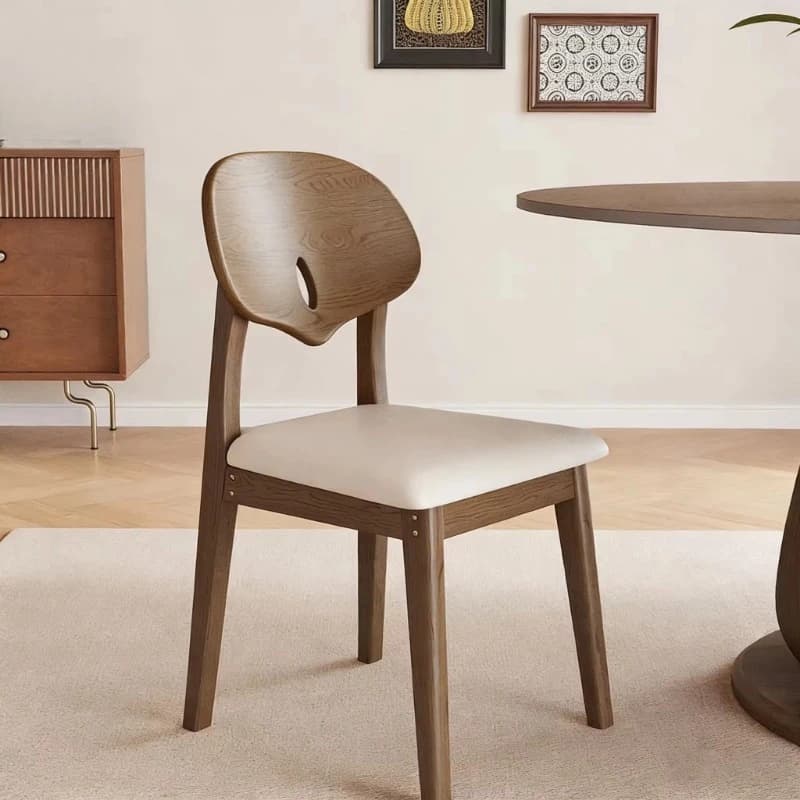 Modern dining chairs with wooden legs and leather soft seats
