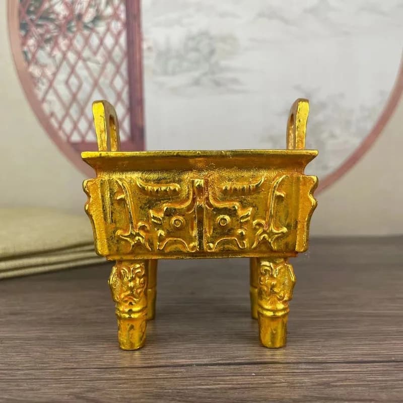 Gilt double-eared four-legged tripod incense burner with animal face pattern, a household offering incense burner, decorative pi