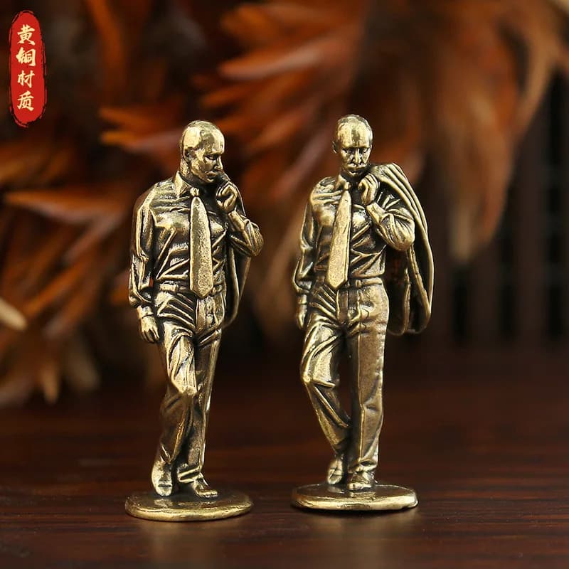 leader figurine, a brass statue of a Puguo figure, a decorative tabletop craft, a copper ornament