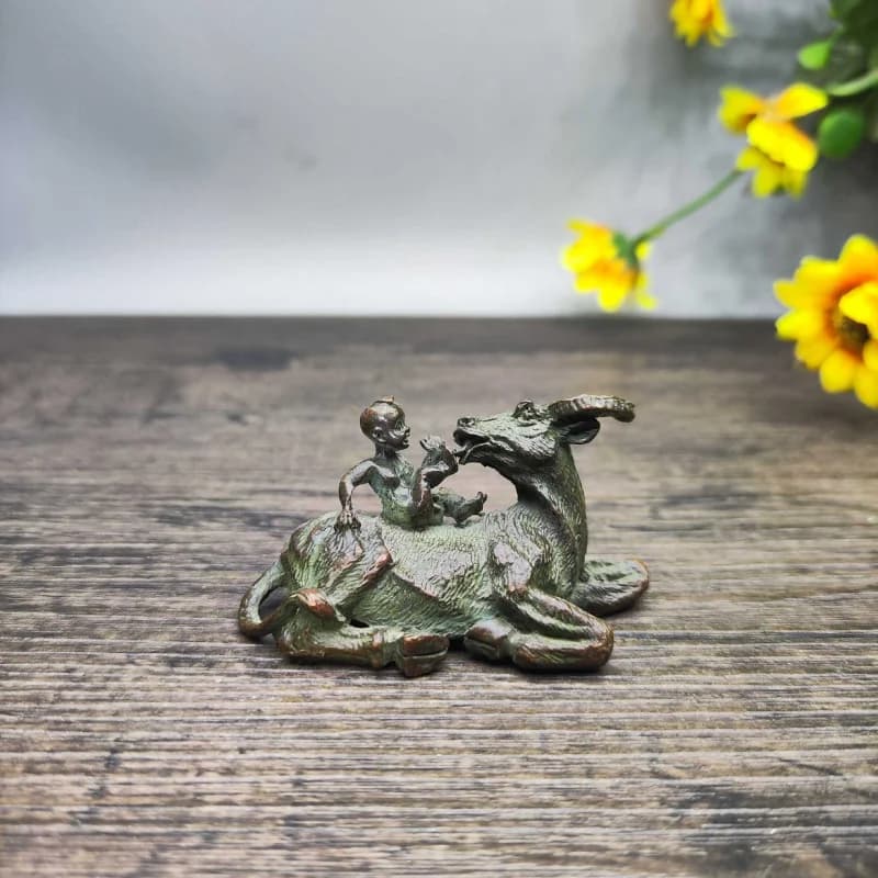 Vintage distressed boy playing a cow home decoration for living room, study, or office desk, finely crafted with complete p