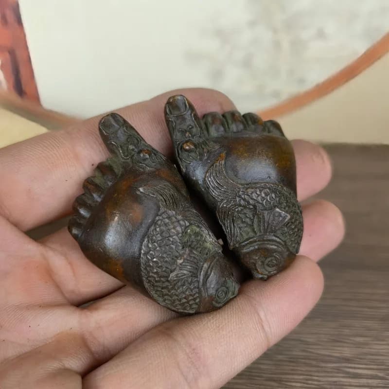 A pair of decorative ornaments for home use, solid paperweights with the message 'May there be and abundance every yea
