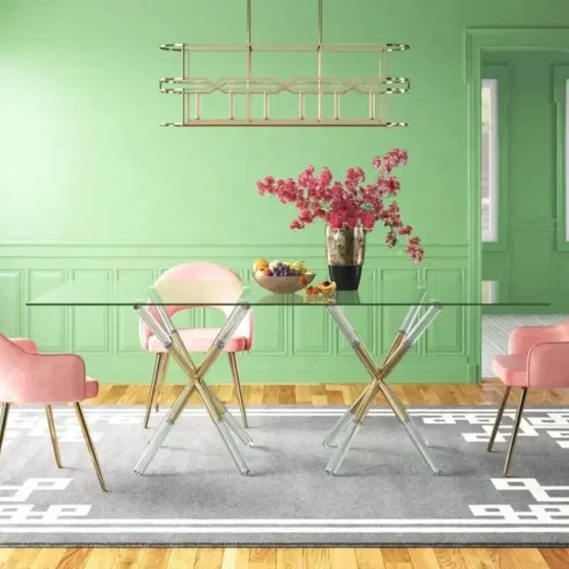 Acrylic dining table with glass top and metal accents