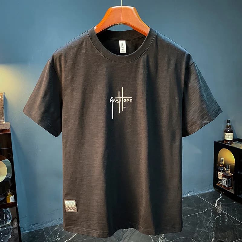 T-shirt men's 2025 summer new fashion simple round neck breathable loose short sleeved comfortable men's top