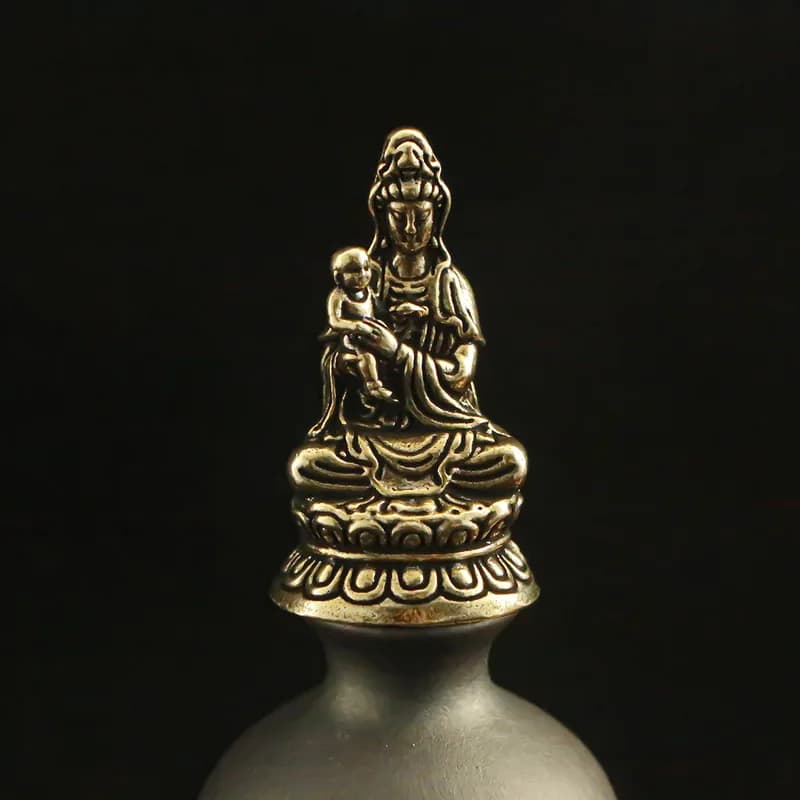 Guanyin statue with a lotus base, a decorative Buddhist figure for home worship and display on a tabletop