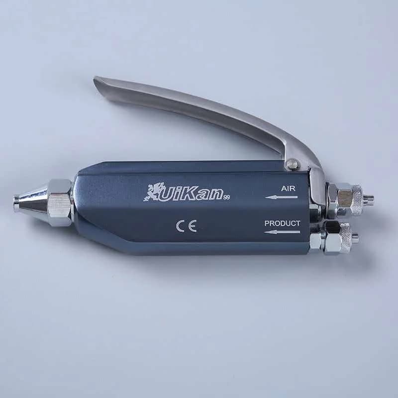 Laundry shop stain remover gun Clothing dry cleaning shop stain remover gun Steam stain remover gun on stain removal table Oil a