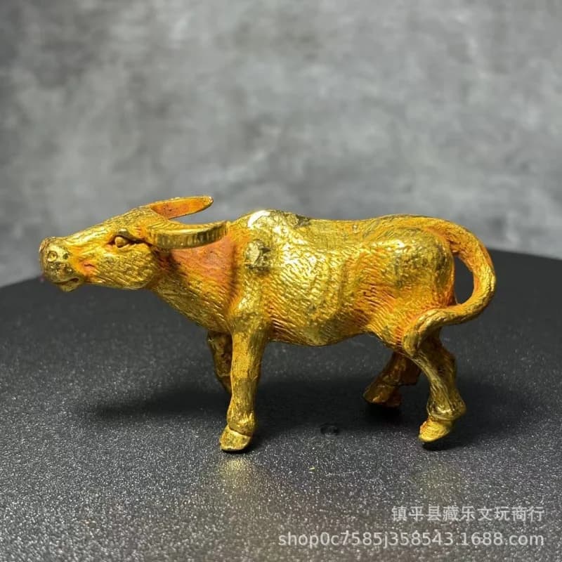 Antique gilded cow figurine, a feng shui mascot for attracting wealth and prosperity in career, tea pet decorative craft