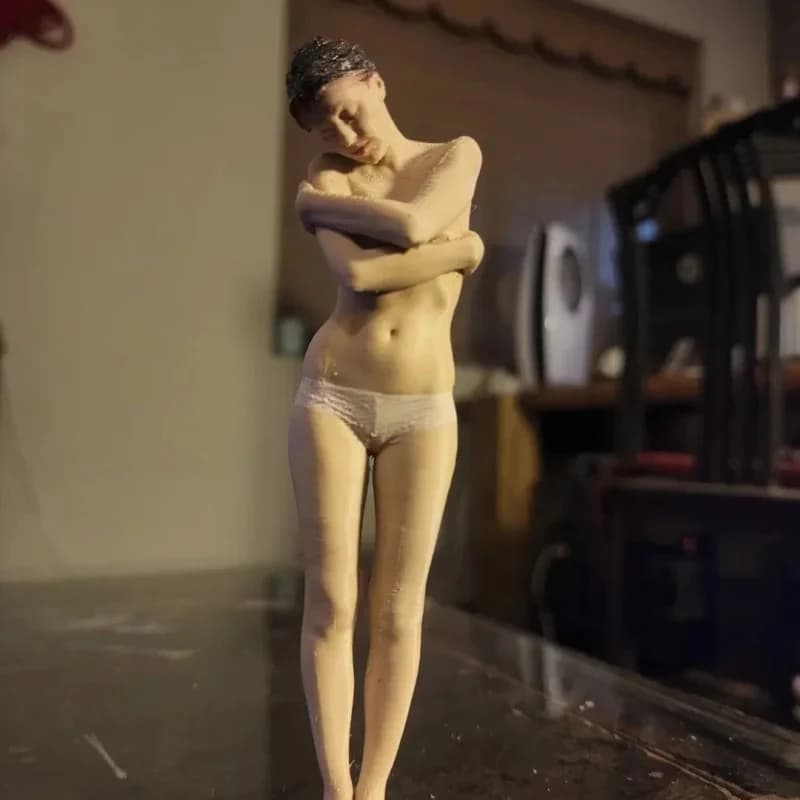 Highly realistic adult figurine with detailed women's features, a confidential display piece.
