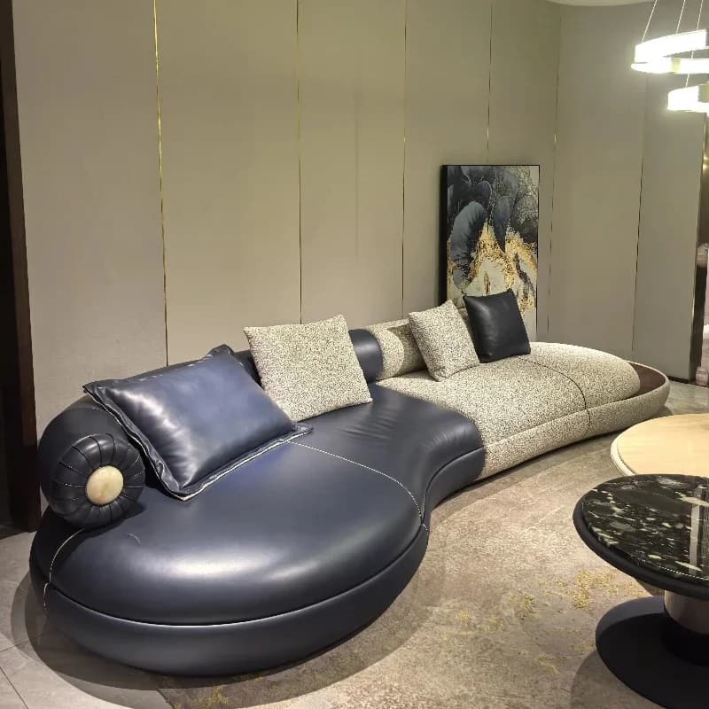 Italian luxury redefined: a designer curved U-shaped corner sofa set in suede satin leather for villas and hotel spaces.