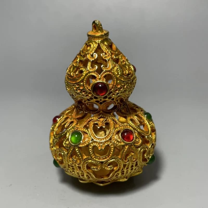 Hollowed-out ornament, gilded and cast using ancient techniques, inlaid with gemstones, gourd-shaped decorative tab